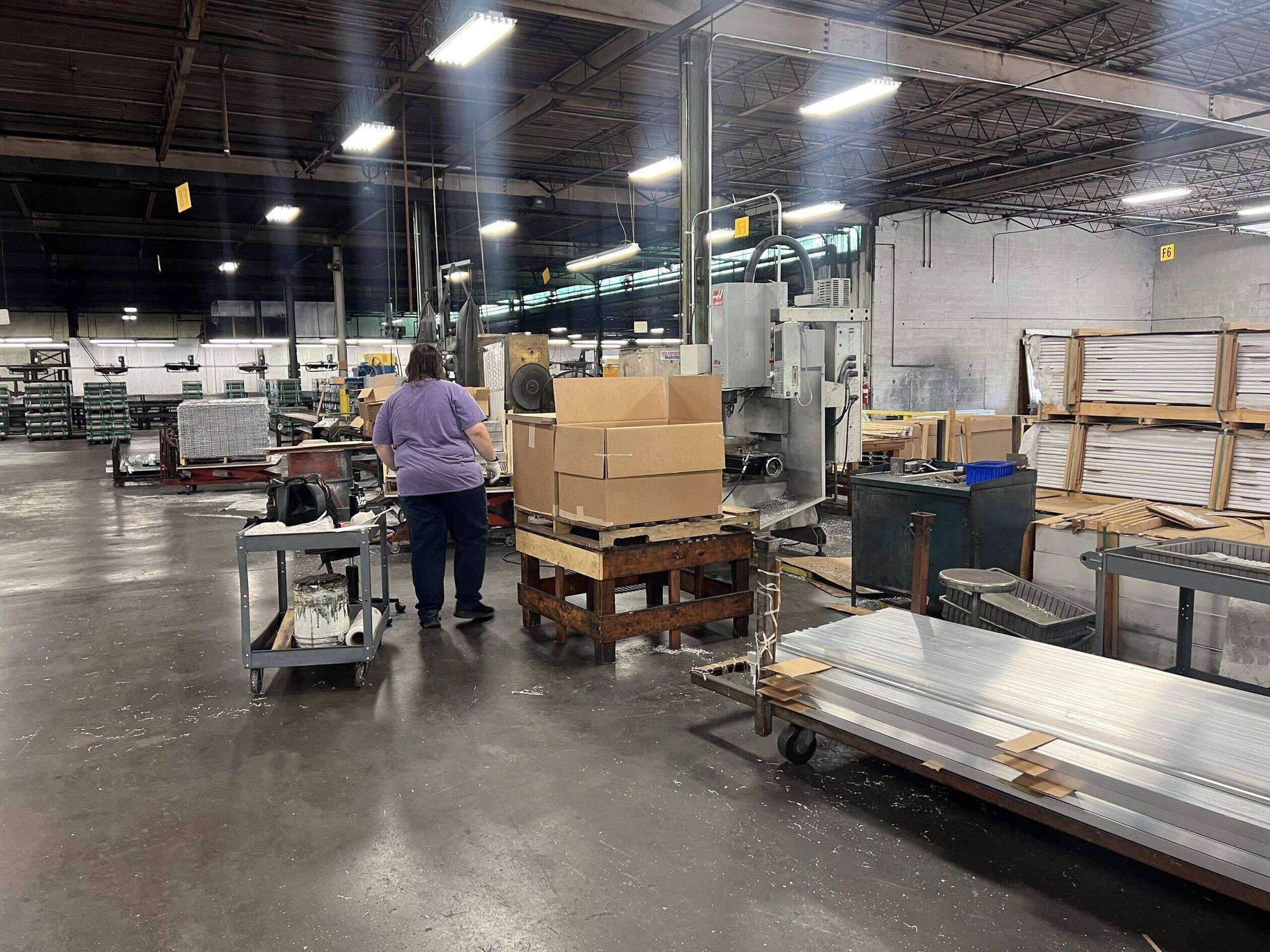 Finished aluminum profiles staged and packaged for shipment at AES